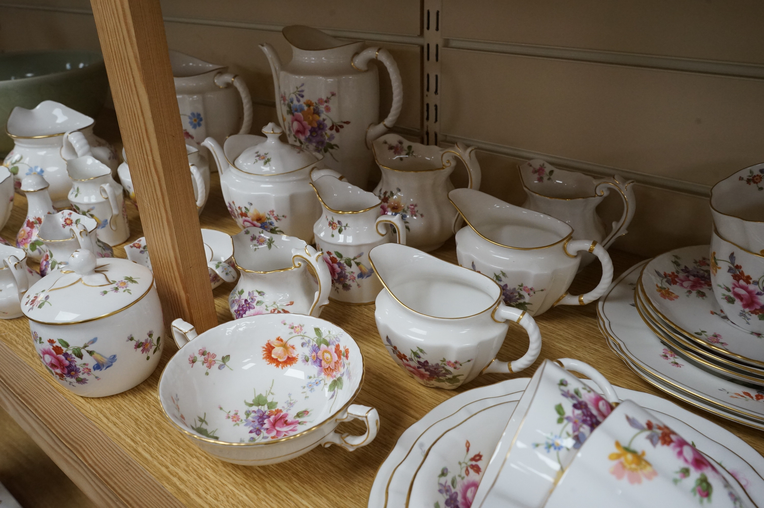 An extensive Crown Derby Posies pattern service to include trios, teapot, jugs and miniatures